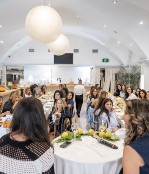 Women seated together at a wellness luncheon in Los Angeles